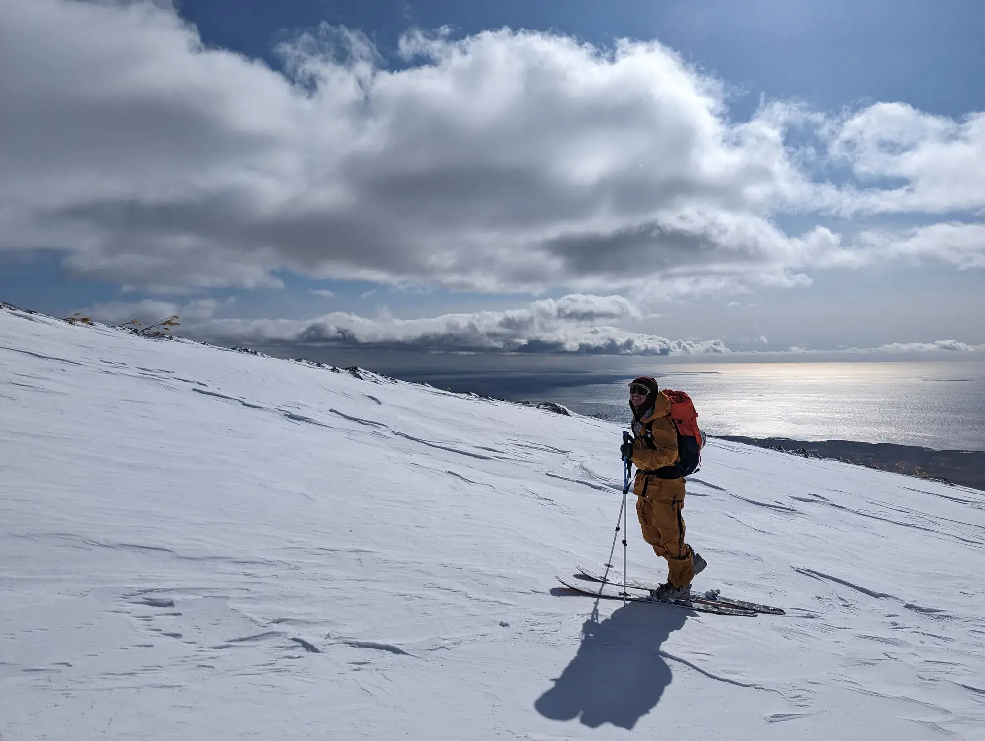 March on Rishiri Island Ski mountaineer on Rishiri Island above the sea