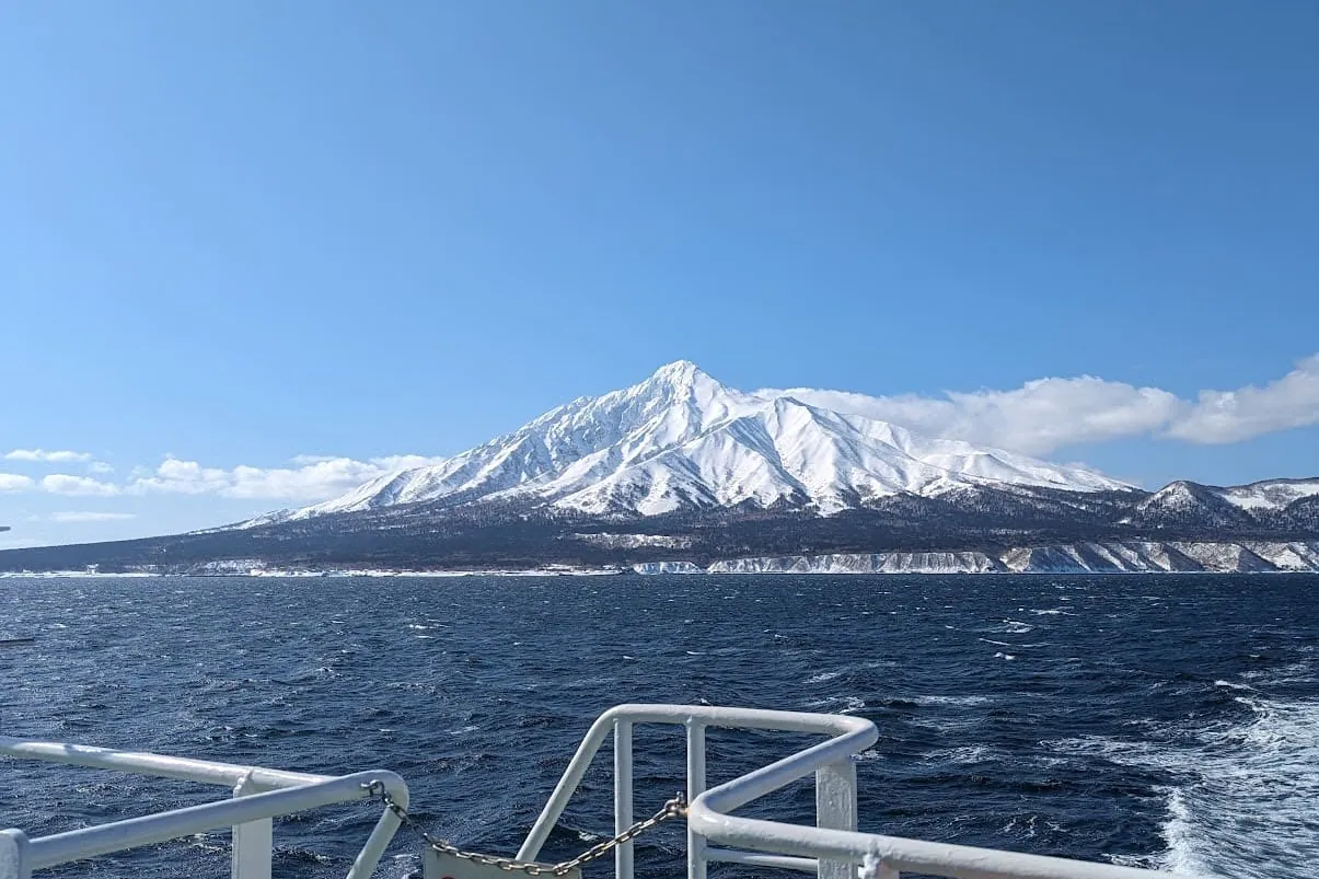 Snow-covered Mount Rishiri rising from the sea on Rishiri Island, northern Hokkaido