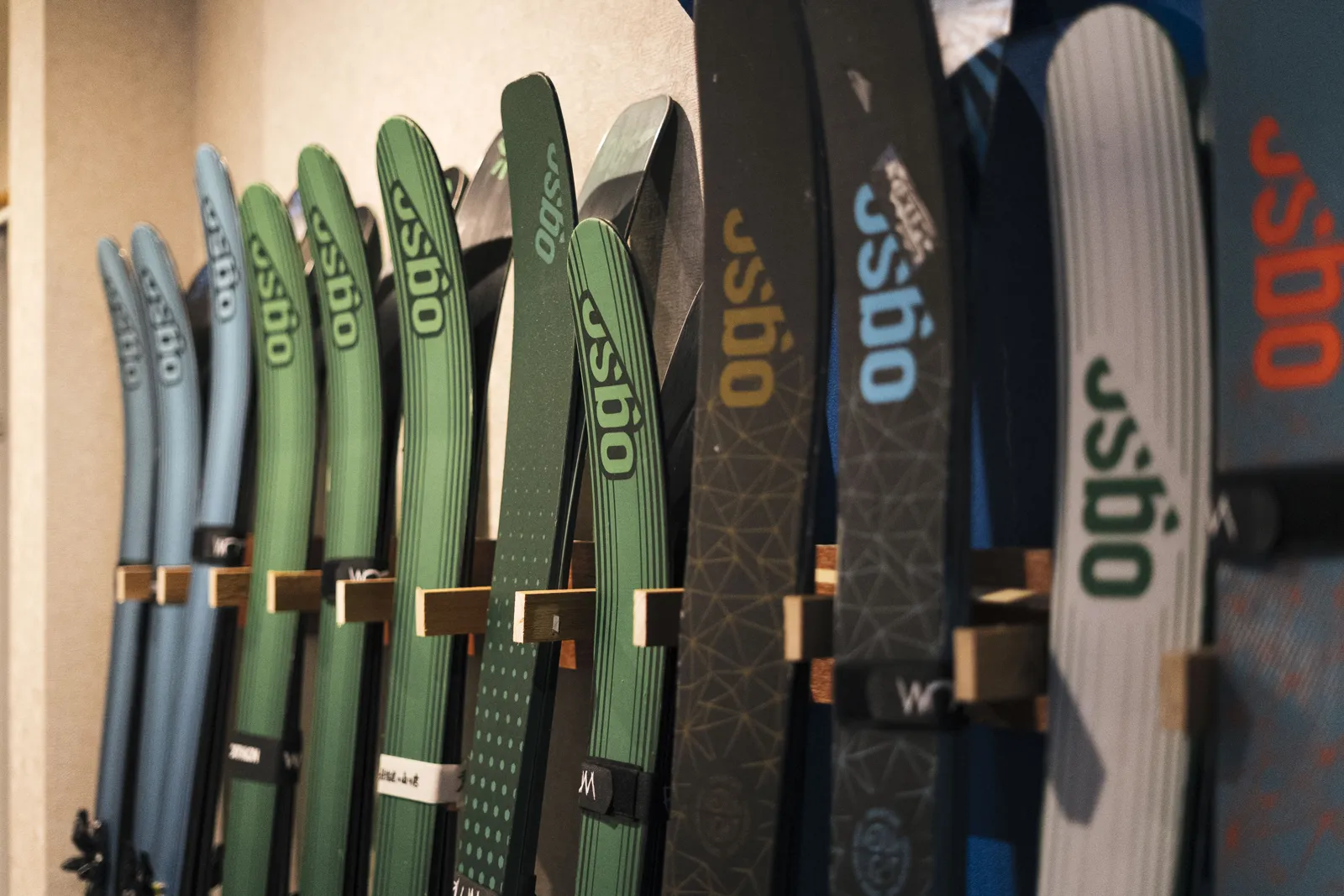 Rack of OGSO touring skis in the Tokachi Base Club backcountry rental shop, Kamifurano